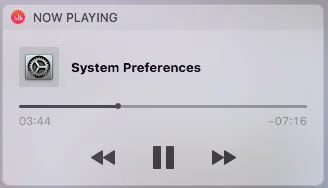 A "Now Playing" popup which shows "system Preferences" as the song playing. 